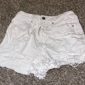 White shorts, pretty short, some holes. Medium